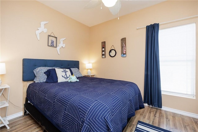 bedroom featuring ceiling fan and wood-type flooring