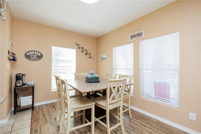 dining area featuring light hardwood / wood-style floors and a wealth of natural light