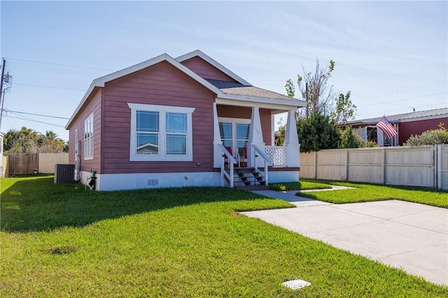 view of front of home featuring central air condition unit and a front lawn