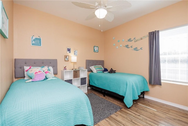 bedroom featuring ceiling fan and wood-type flooring