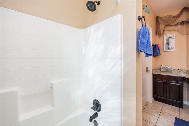 bathroom with tile patterned floors and  shower combination