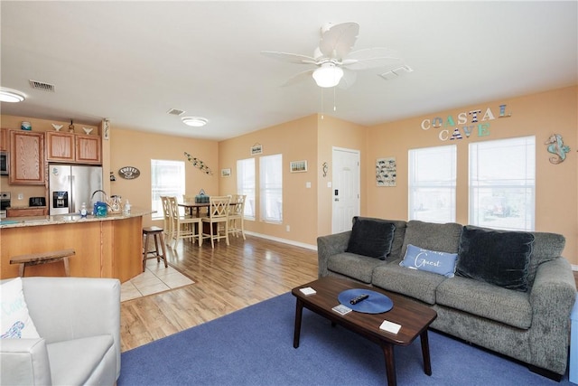 112 Tropical Breeze Ln, Aransas Pass, TX 78336 - living area with ceiling fan and light wood finished floors