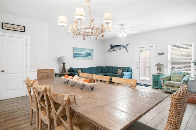 dining area with an inviting chandelier and wood finish floors