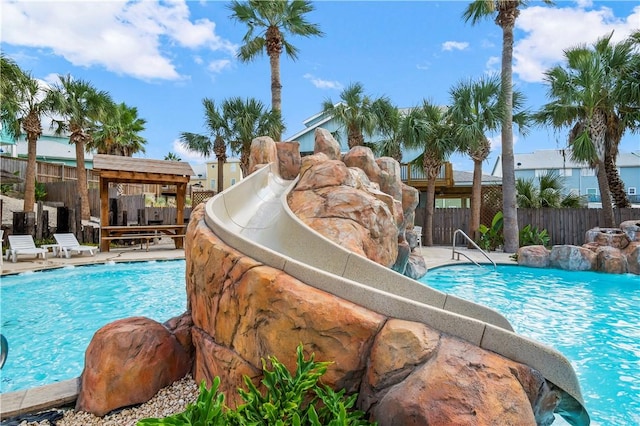 pool featuring a patio and fence