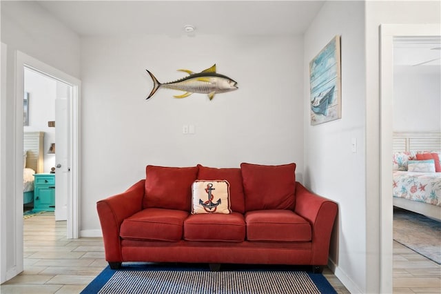 living area featuring wood finished floors and baseboards