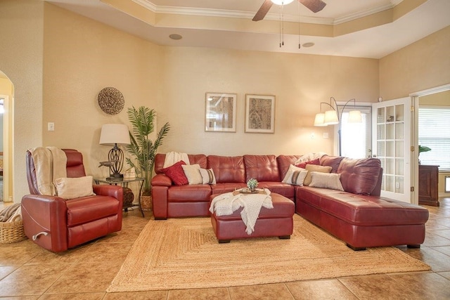 214 Palmer Dr, Portland, TX 78374 - living area with tile patterned flooring, arched walkways, a raised ceiling, and crown molding