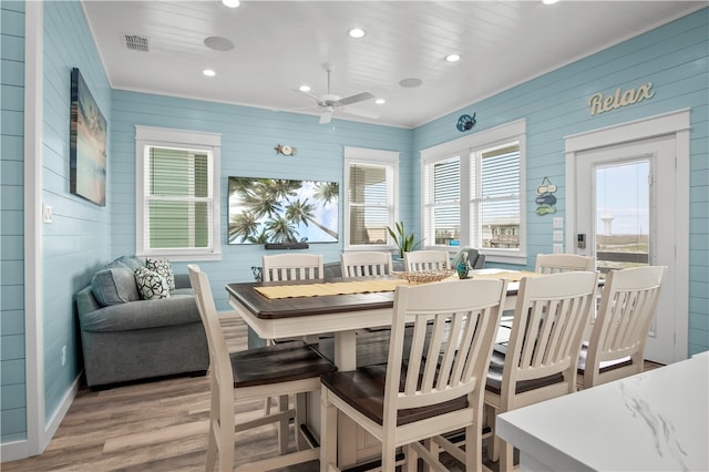 dining room featuring light hardwood / wood-style flooring and ceiling fan