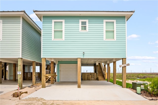 view of front of house featuring a garage and a carport