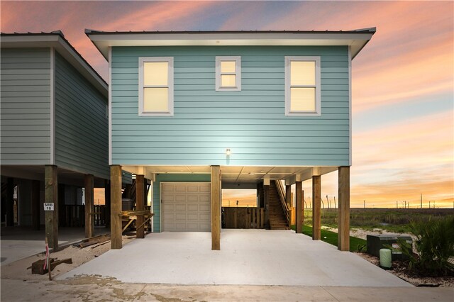 view of front facade featuring a garage and a carport