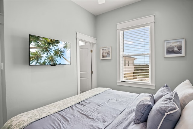 bedroom with multiple windows and ceiling fan