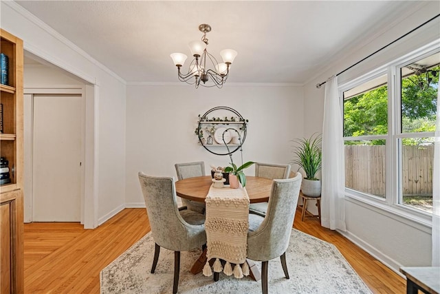 622 Bermuda Pl, Corpus Christi, TX 78411 - dining space featuring a chandelier, crown molding, and light wood-type flooring