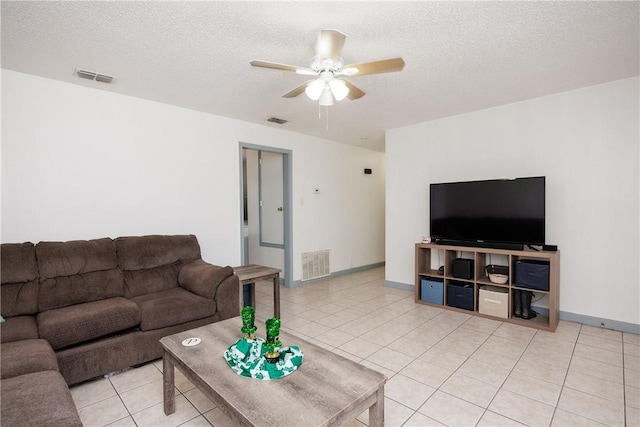 living area with light tile patterned floors and visible vents