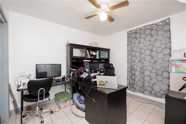 tiled home office with a textured ceiling and a ceiling fan