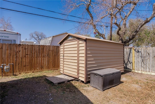 view of shed featuring a fenced backyard