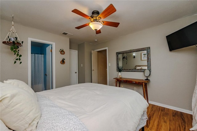 7202 Mansions Dr Unit N1, Corpus Christi, TX 78414 - bedroom featuring baseboards, visible vents, wood finished floors, and ceiling fan
