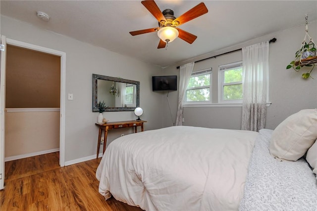 7202 Mansions Dr Unit N1, Corpus Christi, TX 78414 - bedroom featuring baseboards, ceiling fan, and wood finished floors