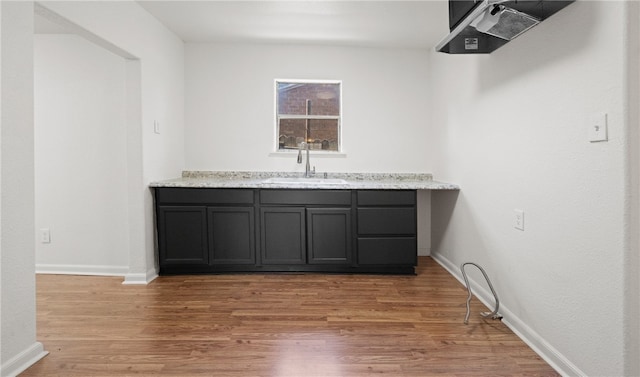 bathroom featuring hardwood / wood-style flooring and sink