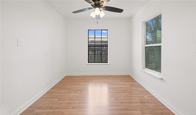 empty room with light hardwood / wood-style floors and ceiling fan