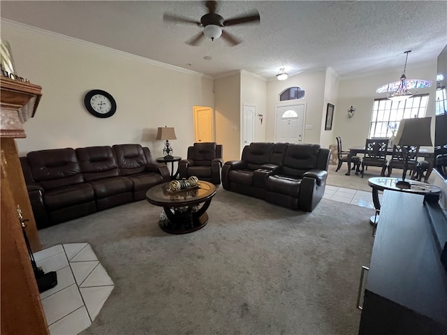 carpeted living room featuring ceiling fan with notable chandelier, a textured ceiling, and ornamental molding