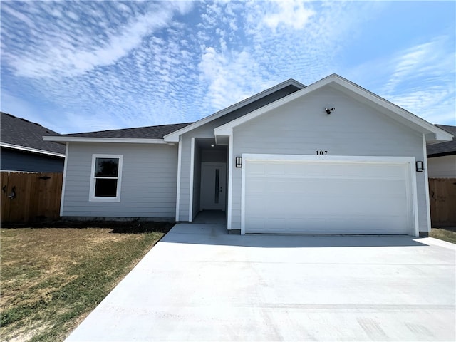 ranch-style house featuring a garage