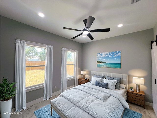 bedroom featuring ceiling fan and light hardwood / wood-style floors