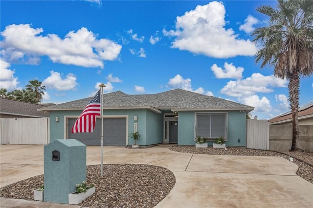 14013 Hawksnest Bay Dr, Corpus Christi, TX 78418 - view of front facade featuring an attached garage, stucco siding, driveway, and a shingled roof