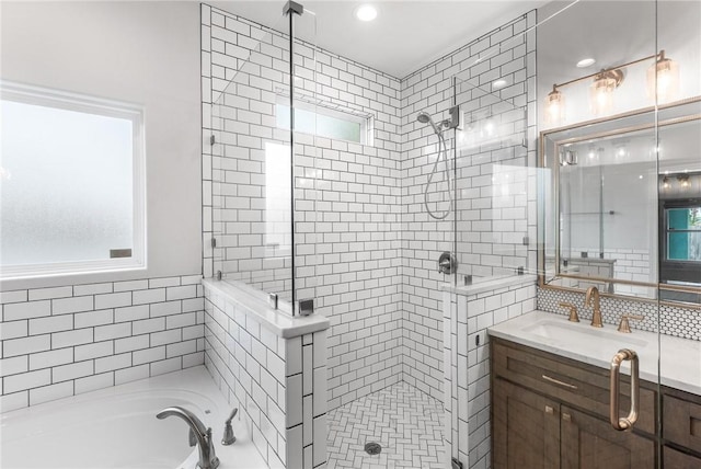 14013 Hawksnest Bay Dr, Corpus Christi, TX 78418 - bathroom featuring a stall shower, vanity, a garden tub, backsplash, and recessed lighting