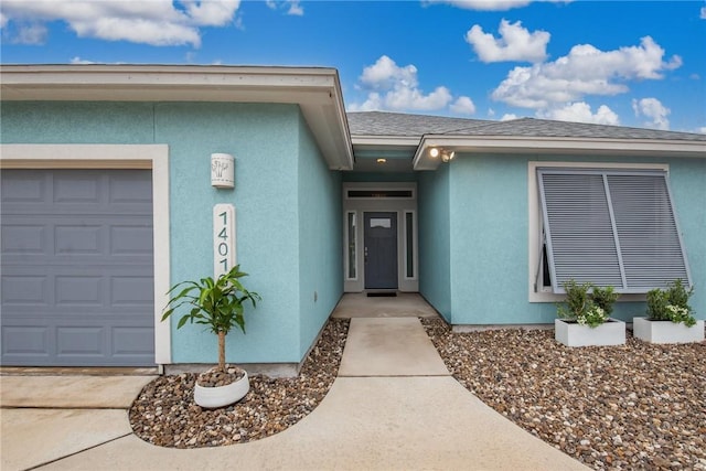 14013 Hawksnest Bay Dr, Corpus Christi, TX 78418 - doorway to property featuring a garage, stucco siding, and roof with shingles