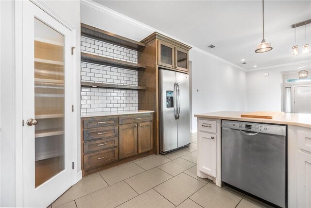 14013 Hawksnest Bay Dr, Corpus Christi, TX 78418 - kitchen featuring stainless steel appliances, light countertops, ornamental molding, open shelves, and decorative backsplash