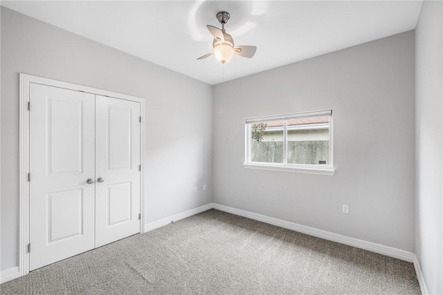 14013 Hawksnest Bay Dr, Corpus Christi, TX 78418 - unfurnished bedroom with carpet floors, a closet, and a ceiling fan