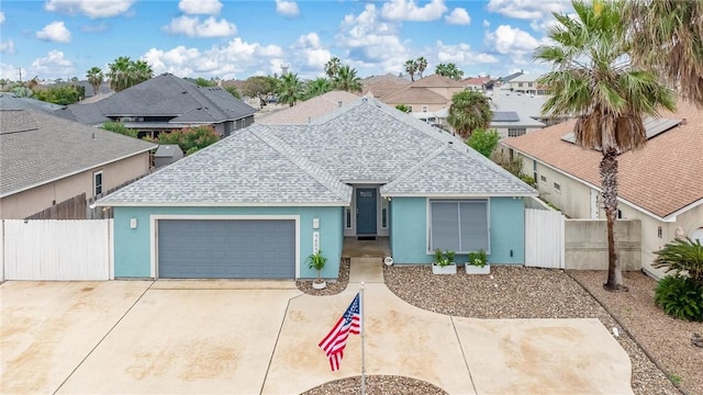 14013 Hawksnest Bay Dr, Corpus Christi, TX 78418 - ranch-style home with roof with shingles, a residential view, an attached garage, and stucco siding