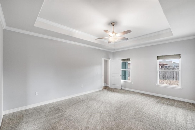 14013 Hawksnest Bay Dr, Corpus Christi, TX 78418 - carpeted spare room with a tray ceiling, crown molding, and a ceiling fan