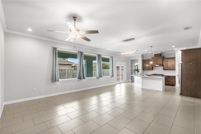 14013 Hawksnest Bay Dr, Corpus Christi, TX 78418 - unfurnished living room with ceiling fan, ornamental molding, light tile patterned flooring, and recessed lighting