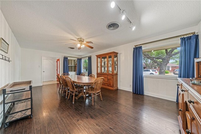 438 Pennington Dr, Corpus Christi, TX 78412 - dining room with a textured ceiling, ceiling fan, dark wood-style flooring, baseboards, and track lighting