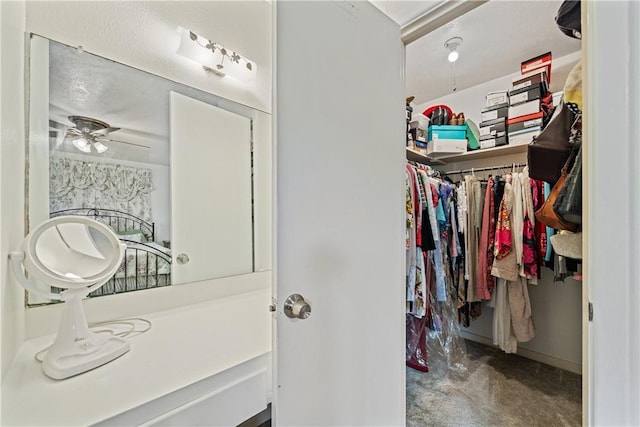 438 Pennington Dr, Corpus Christi, TX 78412 - walk in closet with carpet flooring and a ceiling fan