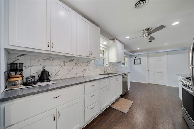 438 Pennington Dr, Corpus Christi, TX 78412 - kitchen with a sink, stainless steel appliances, a ceiling fan, white cabinetry, and recessed lighting