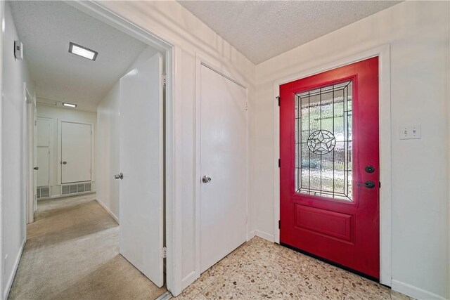 438 Pennington Dr, Corpus Christi, TX 78412 - entryway featuring baseboards and a textured ceiling