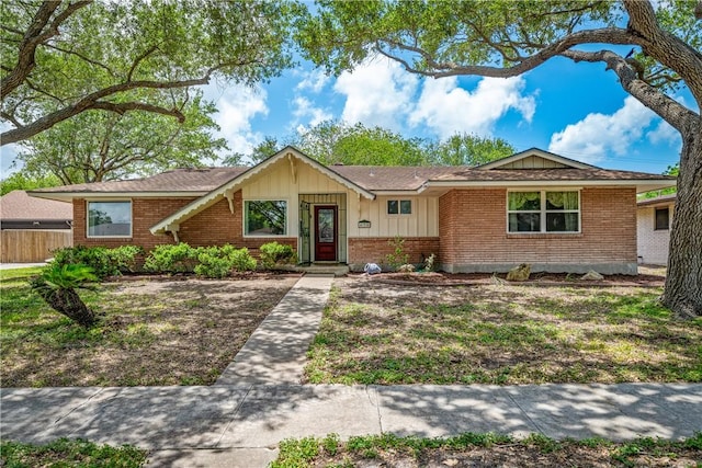 438 Pennington Dr, Corpus Christi, TX 78412 - ranch-style house with brick siding, board and batten siding, and a shingled roof
