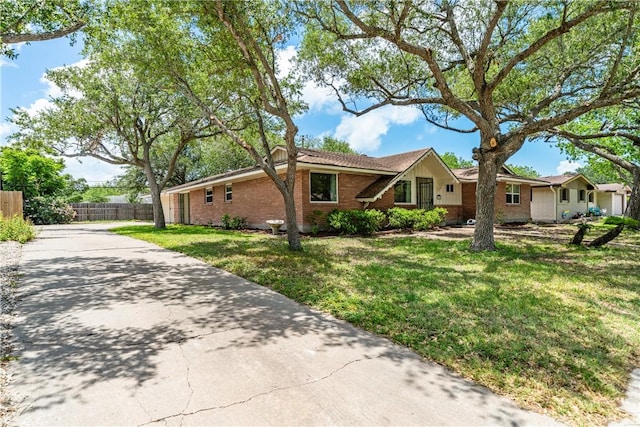438 Pennington Dr, Corpus Christi, TX 78412 - ranch-style home featuring brick siding and driveway