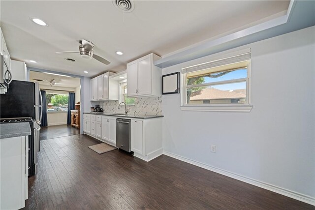 438 Pennington Dr, Corpus Christi, TX 78412 - kitchen with a sink, stainless steel dishwasher, ceiling fan, white cabinetry, and tasteful backsplash