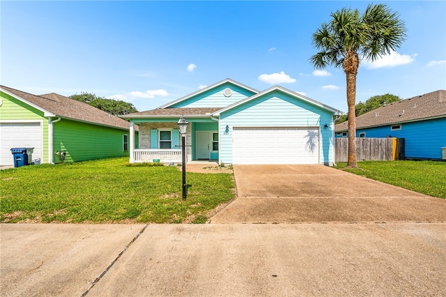 215 Sandollar Cir, Fulton, TX 78358 - view of front of house featuring a porch, a garage, and driveway