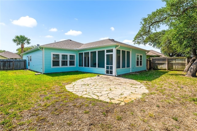 215 Sandollar Cir, Fulton, TX 78358 - rear view of property featuring a patio, a sunroom, and a shingled roof