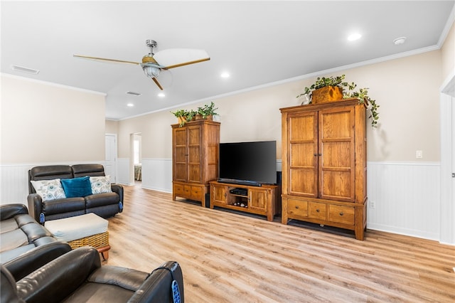 215 Sandollar Cir, Fulton, TX 78358 - living area featuring light wood-style flooring, a ceiling fan, a wainscoted wall, recessed lighting, and ornamental molding