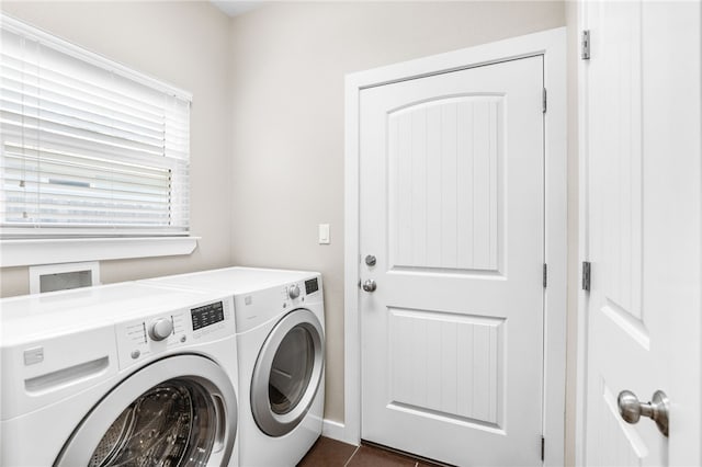 215 Sandollar Cir, Fulton, TX 78358 - laundry area with separate washer and dryer and dark tile patterned floors