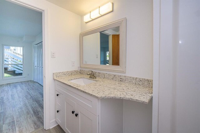 bathroom featuring vanity and wood-type flooring