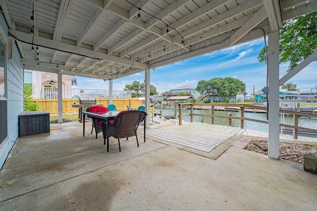 view of patio with a water view