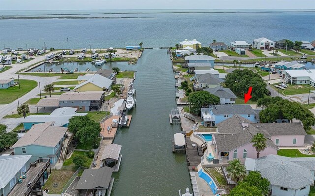 birds eye view of property with a water view