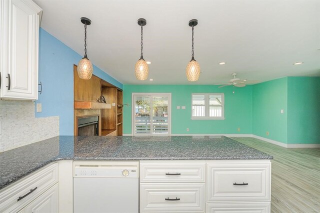 kitchen with dishwasher and white cabinetry