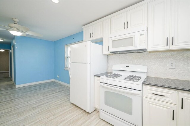 kitchen featuring light wood-type flooring, tasteful backsplash, white appliances, ceiling fan, and white cabinetry