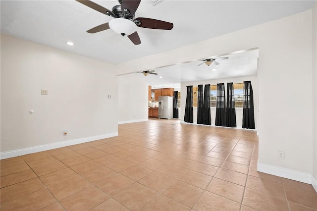 unfurnished living room with light tile patterned flooring